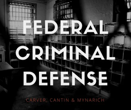 Federal Criminal Defense graphic over a prison cell