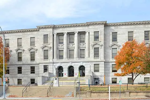 A county courthouse building on an autumn day