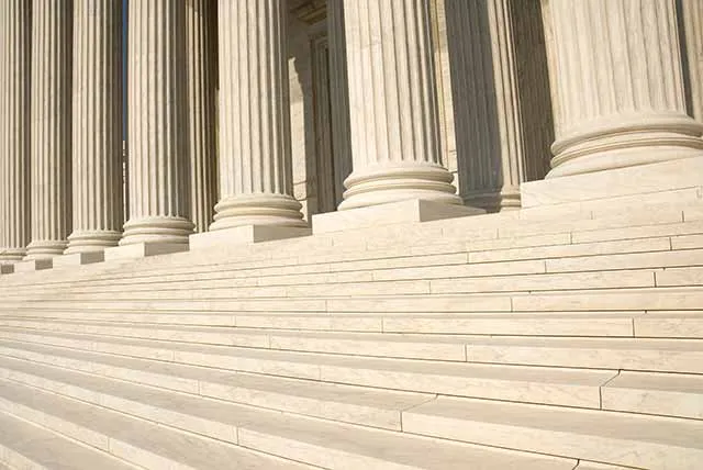 Stone columns along the front of a federal courthouse