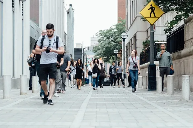 Pedestrians walking along a city sidewalk