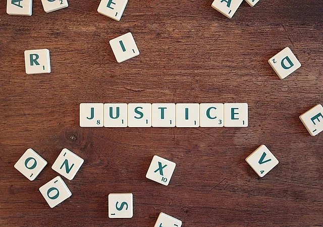 Letter tiles spelling the word justice
