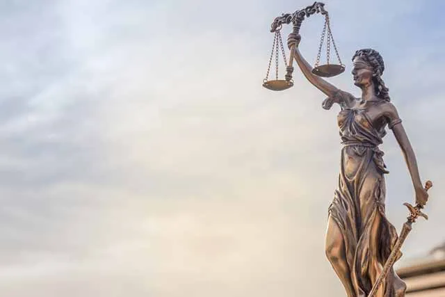 A statue of Lady Justice holding the scales