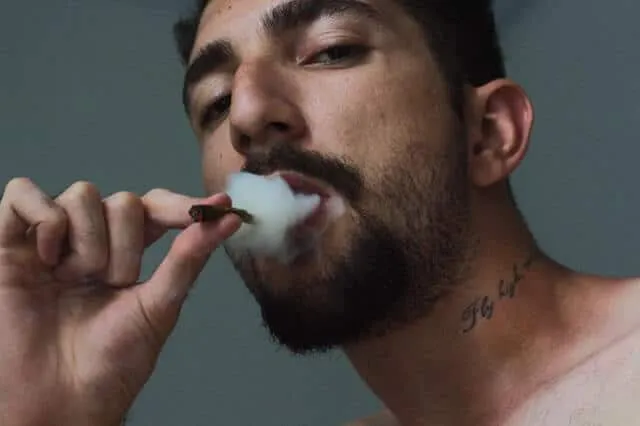 A man taking a pill